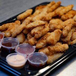 Portion of boneless chicken with dips