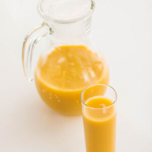 Orange juice in a jug. Juice add on