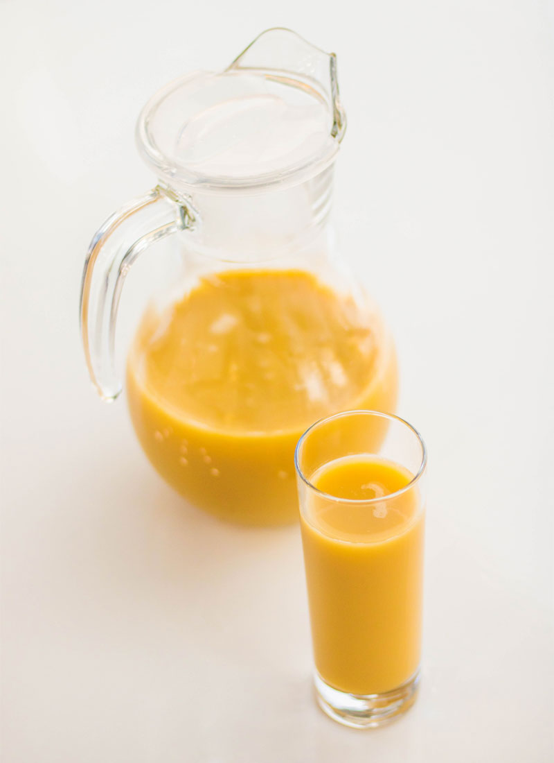 Orange juice in a jug. Juice add on