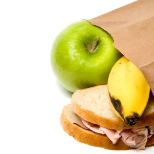 Sandwich, banana and apple in packed lunch