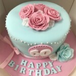 blue decorated birthday cake with pink flowers